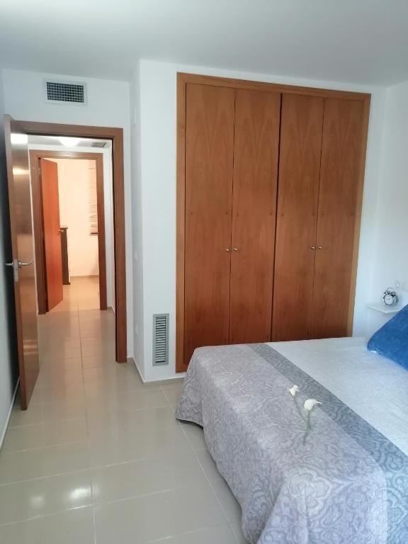 Postel nebo postele na pokoji v ubytování Residencial La Cala