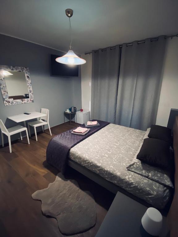 Postel nebo postele na pokoji v ubytování Affittacamere da Jasmina Venzone