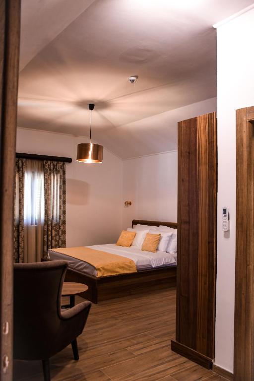 Postel nebo postele na pokoji v ubytování Forte Rose Hotel