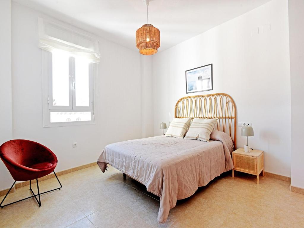 Posteľ alebo postele v izbe v ubytovaní Apartamentos Santiago