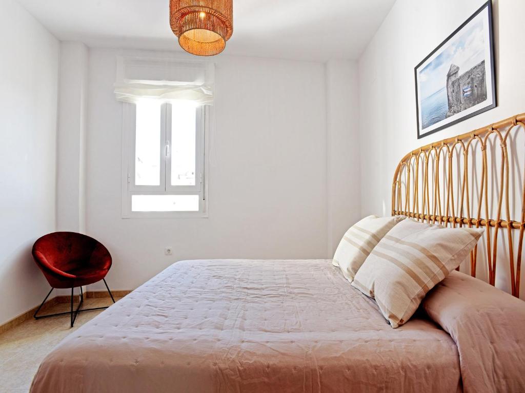Posteľ alebo postele v izbe v ubytovaní Apartamentos Santiago