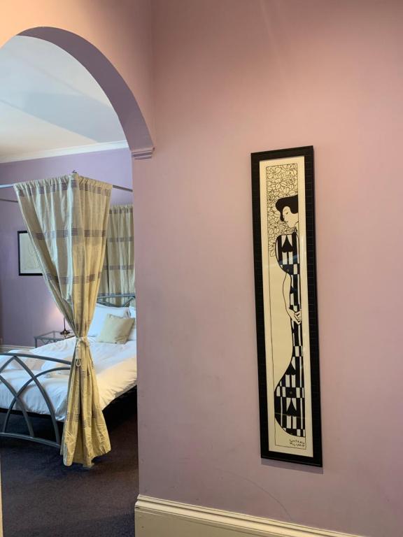 Postel nebo postele na pokoji v ubytování Southside Guest House