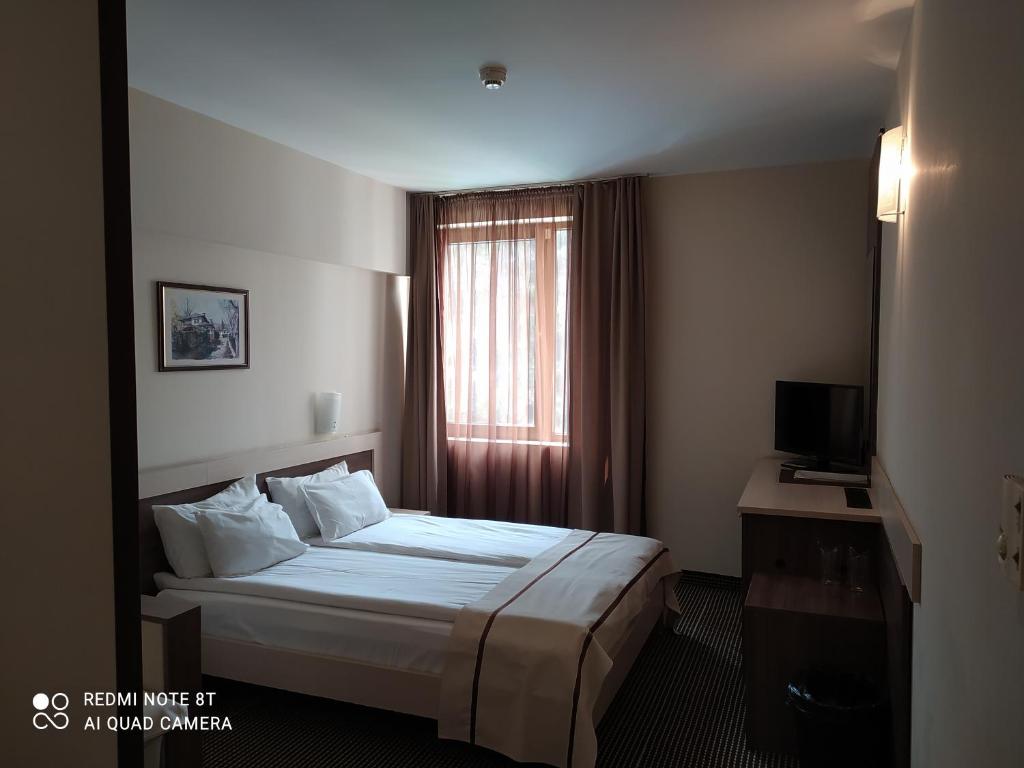 Postel nebo postele na pokoji v ubytování Spa Hotel Kleptuza