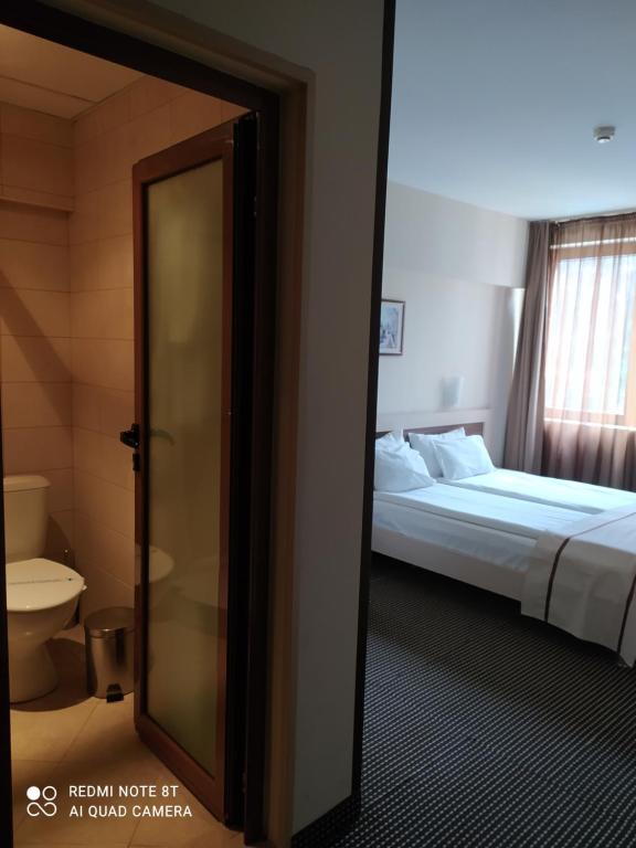Postel nebo postele na pokoji v ubytování Spa Hotel Kleptuza
