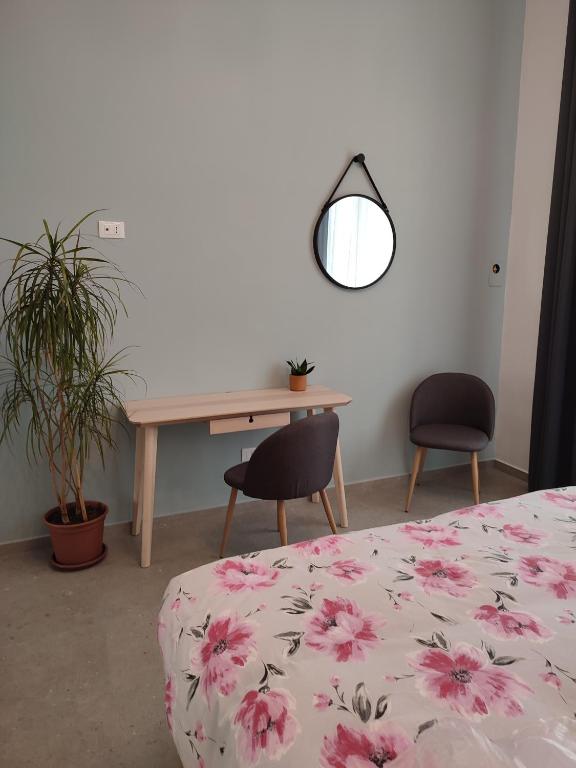 Łóżko lub łóżka w pokoju w obiekcie La casa di Filomena