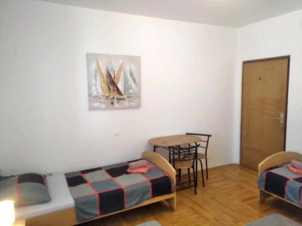 Postel nebo postele na pokoji v ubytování Large Apartment Duje