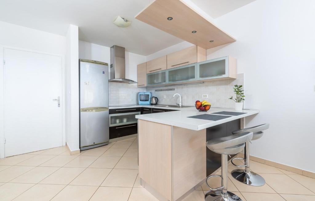 Kuchyň nebo kuchyňský kout v ubytování Apartment MIA