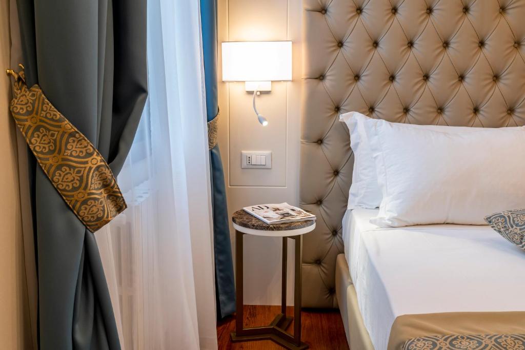 Posteľ alebo postele v izbe v ubytovaní Residenza La Duchessa Deluxe Rooms