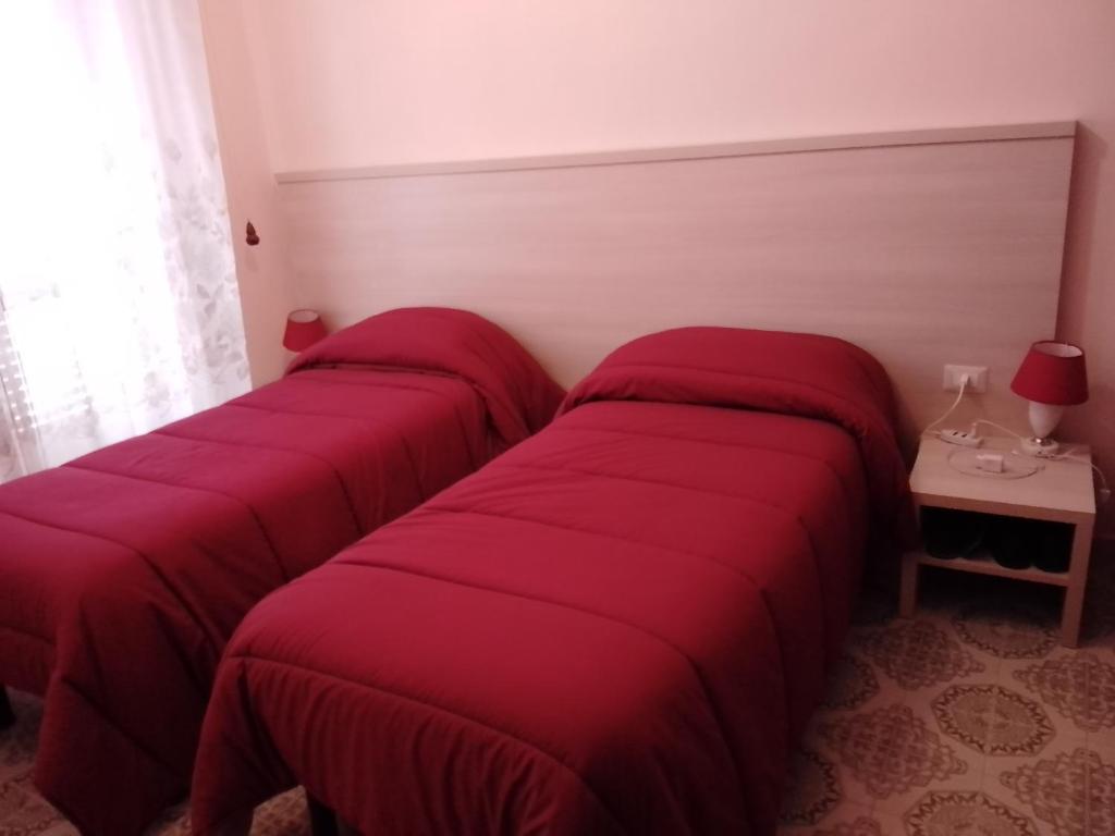 Postel nebo postele na pokoji v ubytování Albergo Maria Cristina