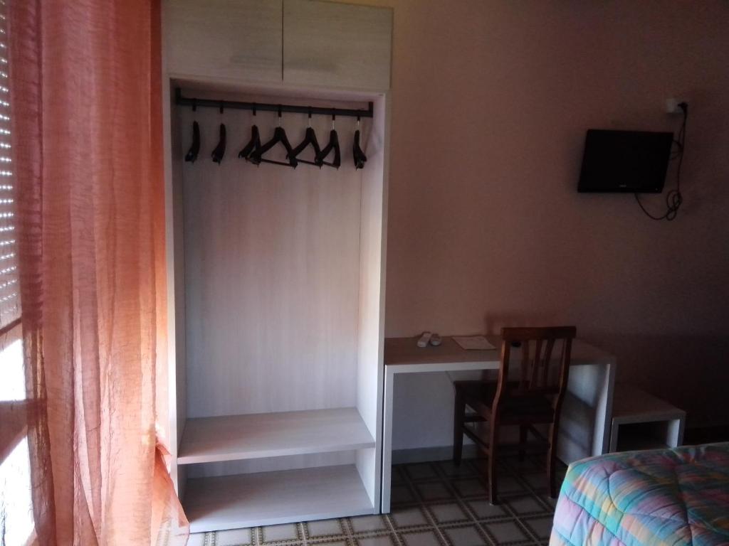 TV a/nebo společenská místnost v ubytování Albergo Maria Cristina
