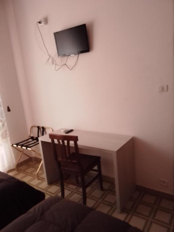 TV a/nebo společenská místnost v ubytování Albergo Maria Cristina