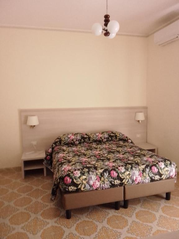 Postel nebo postele na pokoji v ubytování Albergo Maria Cristina