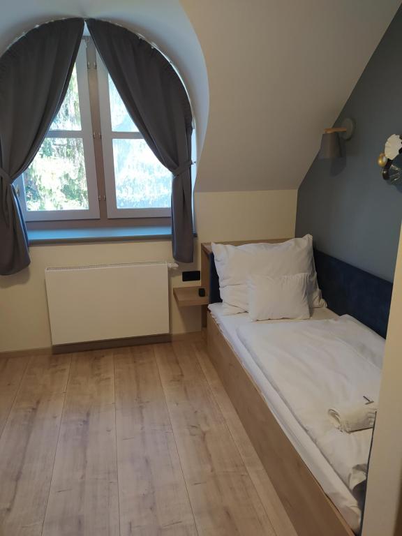 Postel nebo postele na pokoji v ubytování Katarina Birtok