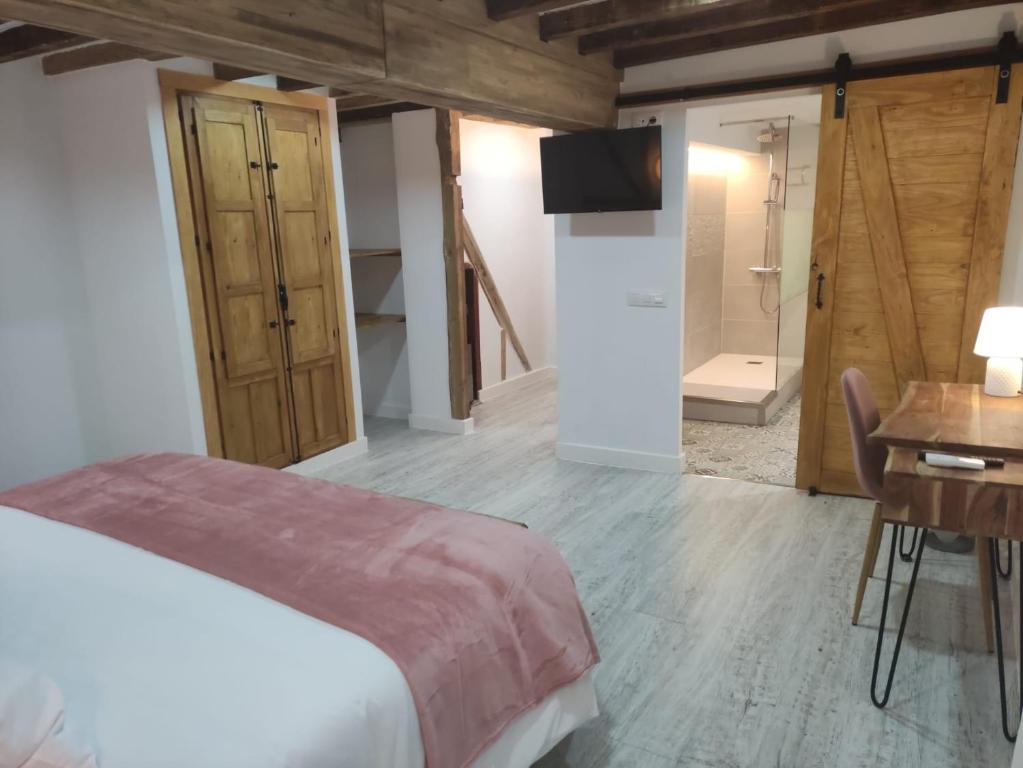 Postel nebo postele na pokoji v ubytování Casa Rural el Rincón de Monfragüe