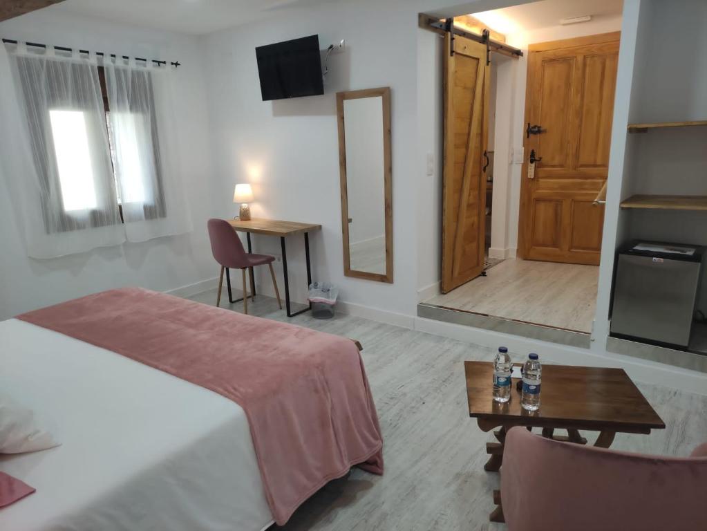 Postel nebo postele na pokoji v ubytování Casa Rural el Rincón de Monfragüe