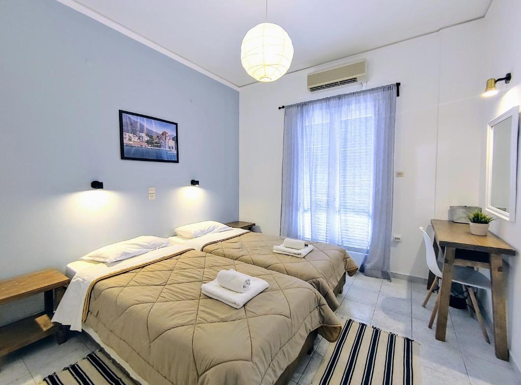 Postel nebo postele na pokoji v ubytování Hotel Aegina