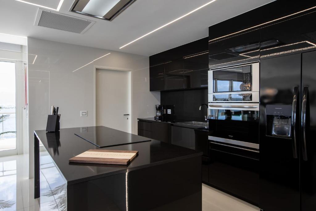 Kuchyň nebo kuchyňský kout v ubytování Serenity Penthouse
