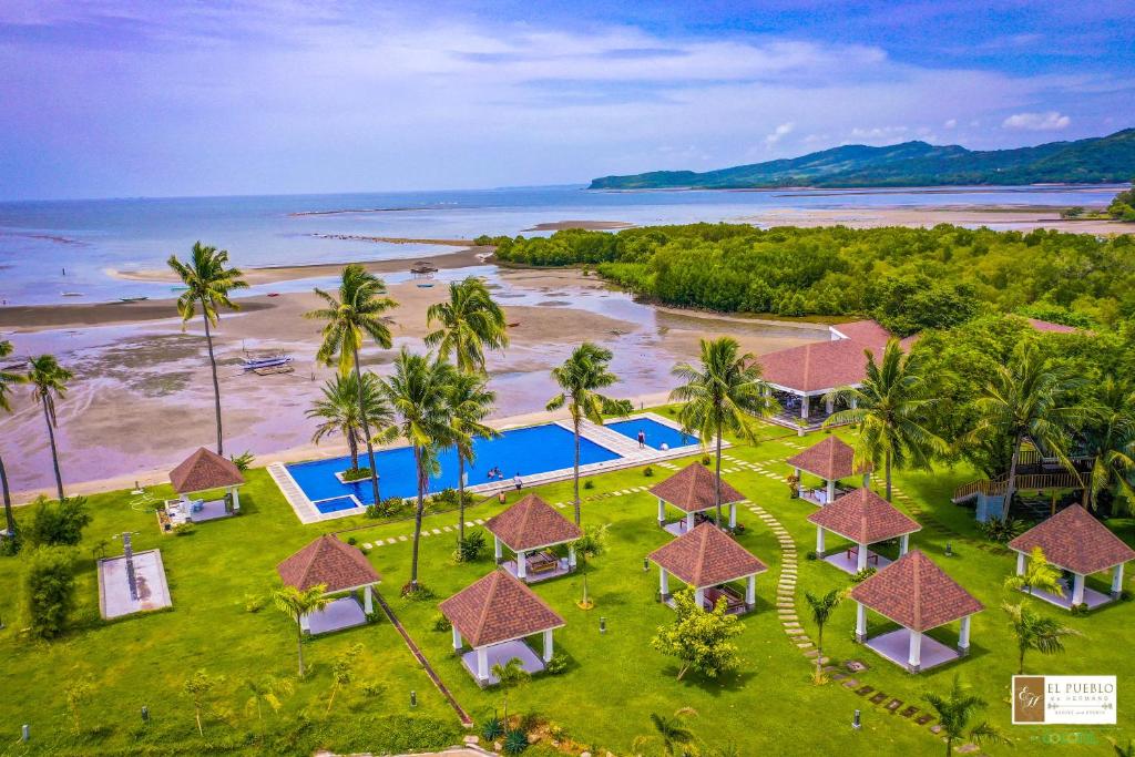 an aerial view of the resort and the beach at El Pueblo De Hermano by Cocotel in Lian