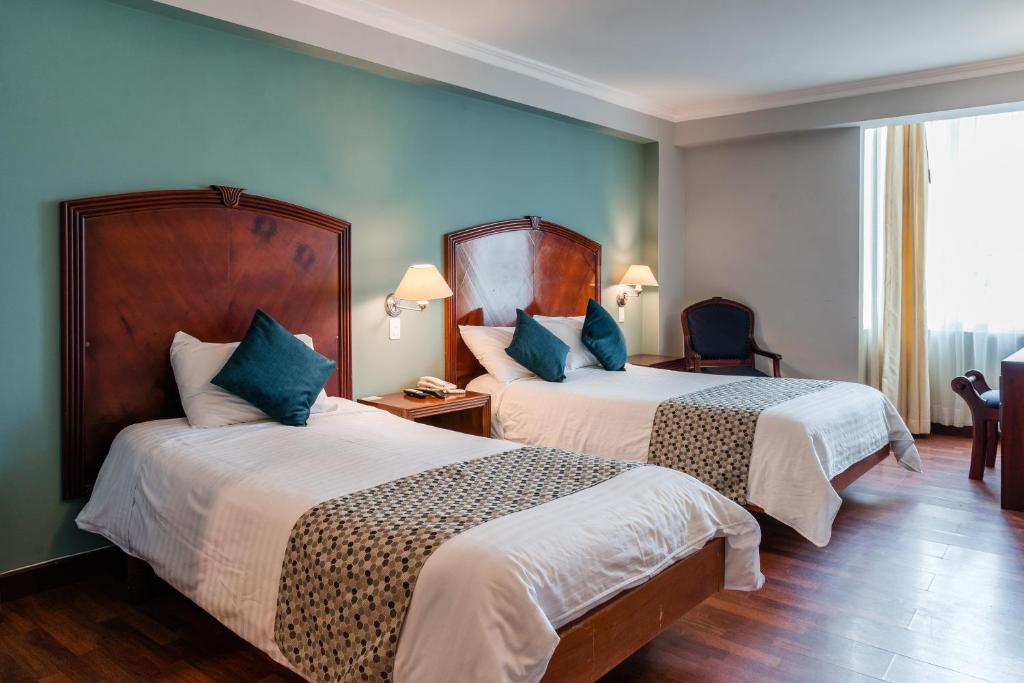 Postel nebo postele na pokoji v ubytování Hotel Libertador