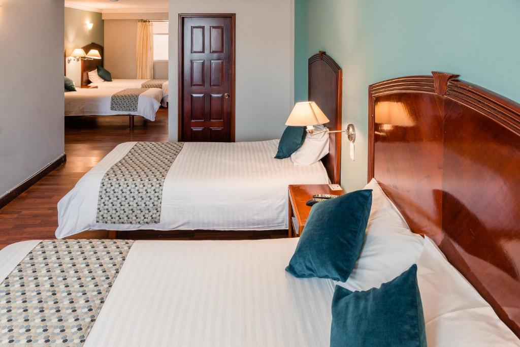 Postel nebo postele na pokoji v ubytování Hotel Libertador