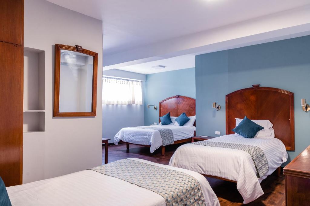Postel nebo postele na pokoji v ubytování Hotel Libertador