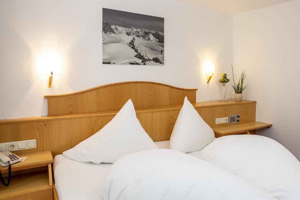 Posteľ alebo postele v izbe v ubytovaní Hotel Garni Tyola
