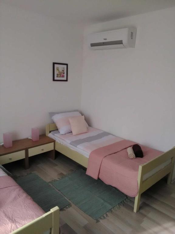 Posteľ alebo postele v izbe v ubytovaní Apartman Periska