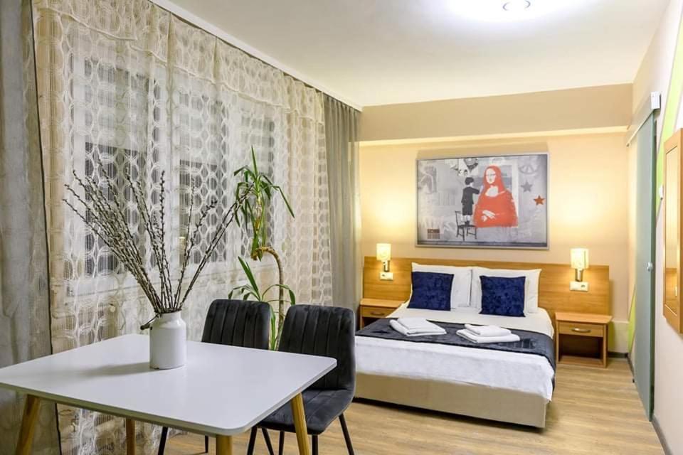 Łóżko lub łóżka w pokoju w obiekcie Wandorf 125 Apartman