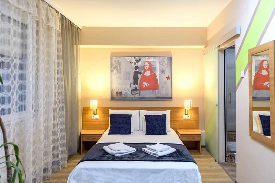 Łóżko lub łóżka w pokoju w obiekcie Wandorf 125 Apartman