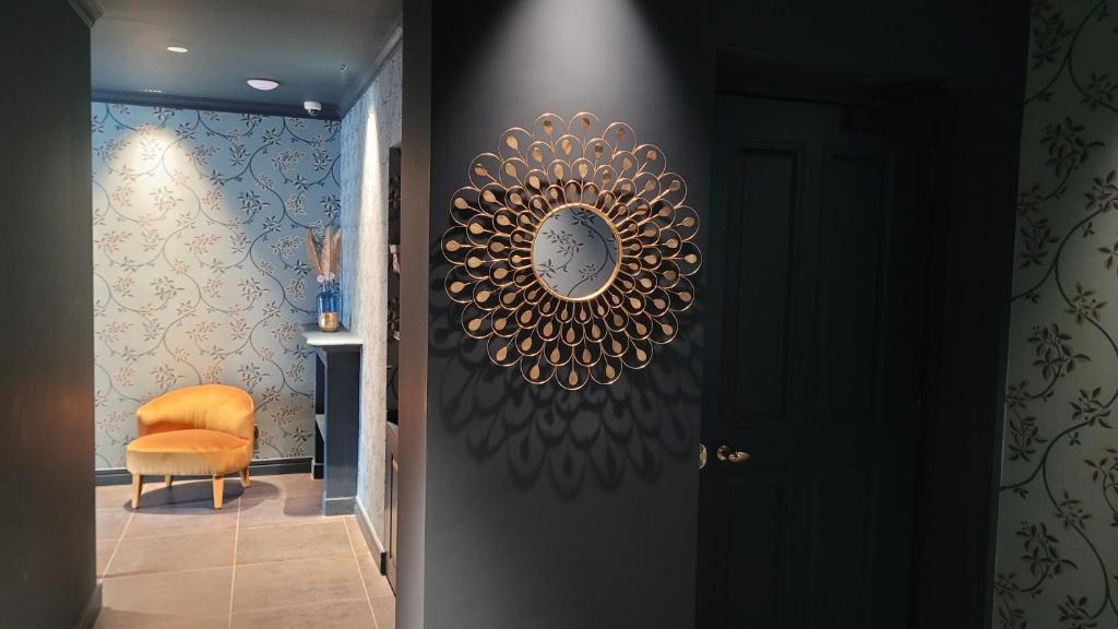 a hallway with a gold plate on the wall at Santarella Guest House in Milan