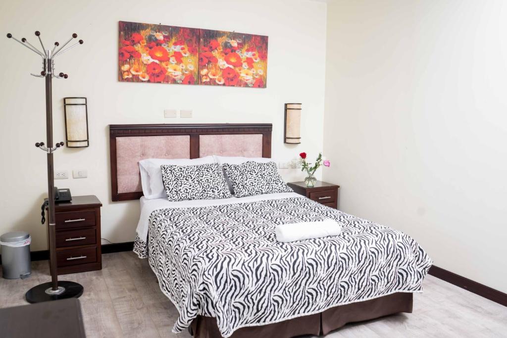 Postel nebo postele na pokoji v ubytování Hotel Loja Bella