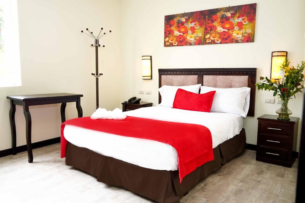 Postel nebo postele na pokoji v ubytování Hotel Loja Bella