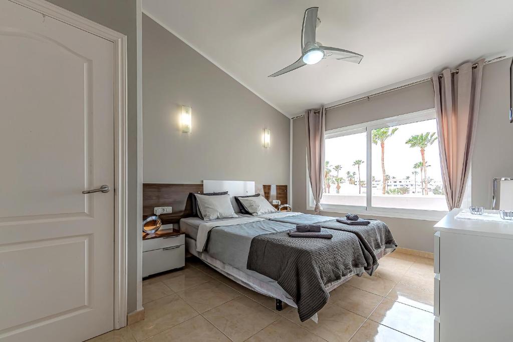 Postel nebo postele na pokoji v ubytování La Rosa de los vientos luxury apartment