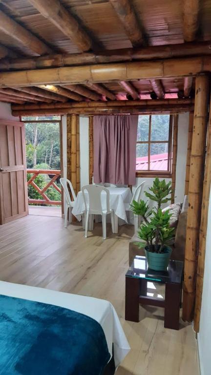 Ένα ή περισσότερα κρεβάτια σε δωμάτιο στο Villa Ester Hostel Vereda Cay