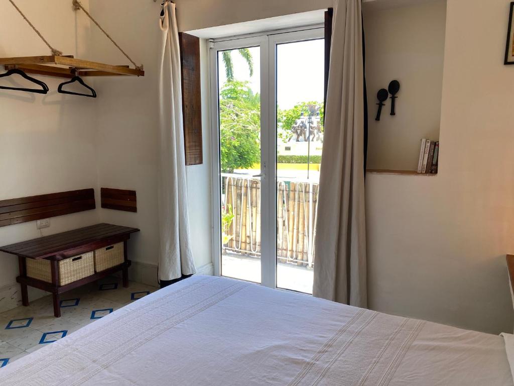 Postel nebo postele na pokoji v ubytování Hotel La Piazzetta