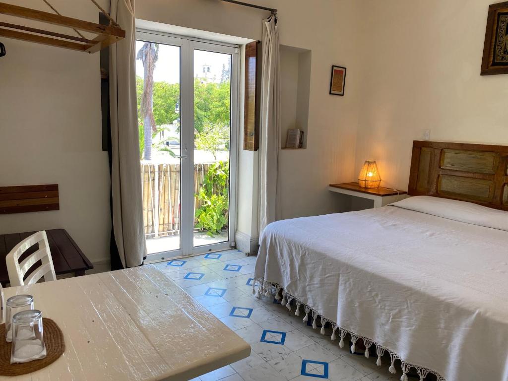 Postel nebo postele na pokoji v ubytování Hotel La Piazzetta