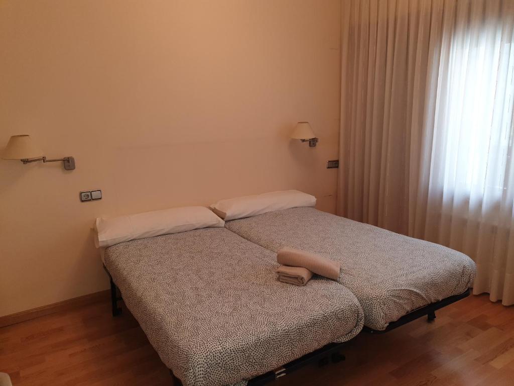 Postel nebo postele na pokoji v ubytování Quintanar Jaca