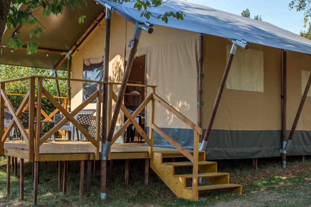 a tent with a staircase inside of it at Safari Tent XL Camping Belle-Vue in Berdorf