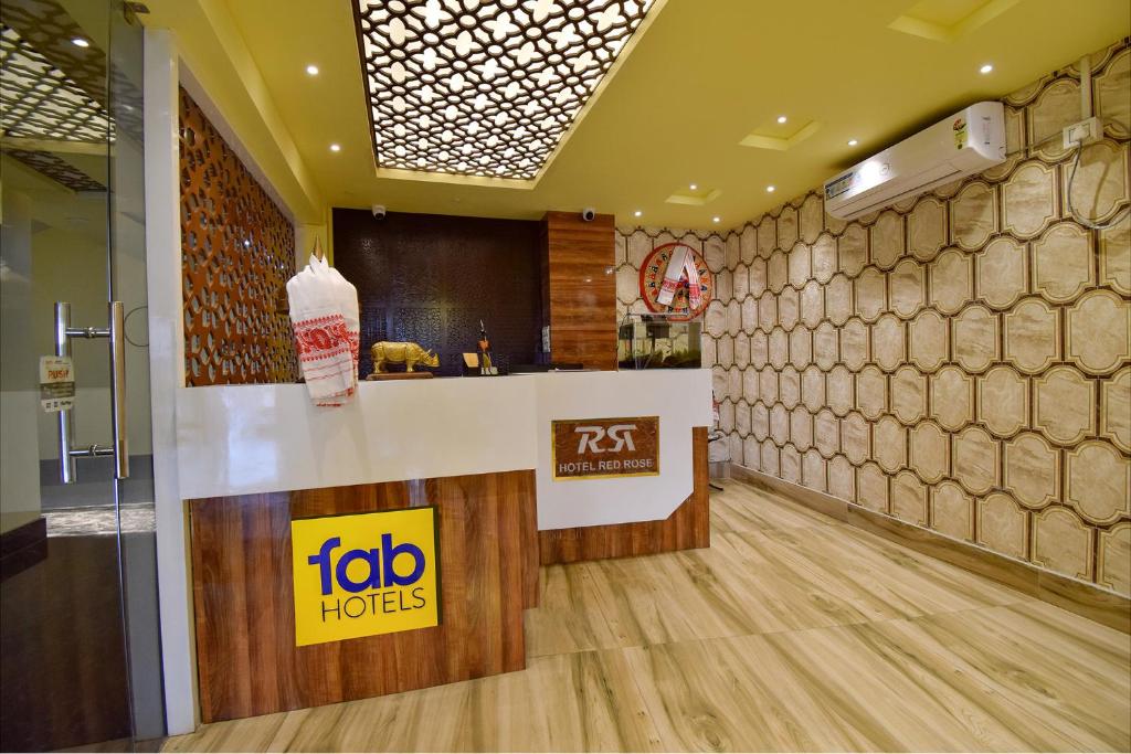 a fast food restaurant with a counter in a room at FabHotel Red Rose in Amingaon