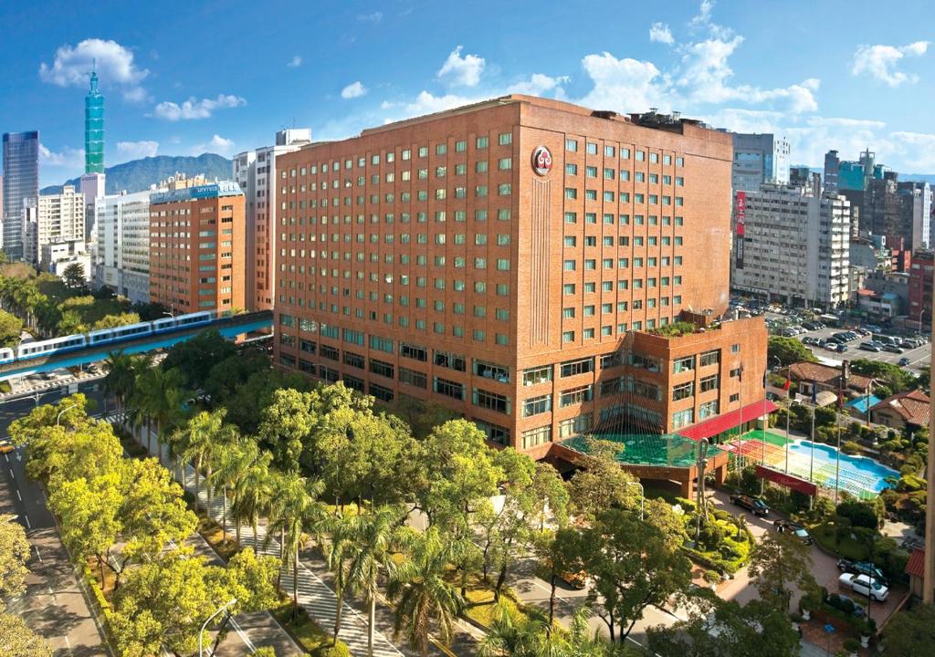 an overhead view of a large building in a city at The Howard Plaza Hotel Taipei in Taipei