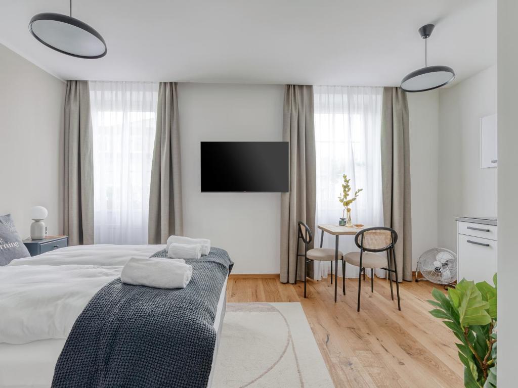 Posteľ alebo postele v izbe v ubytovaní limehome Villach Gerbergasse
