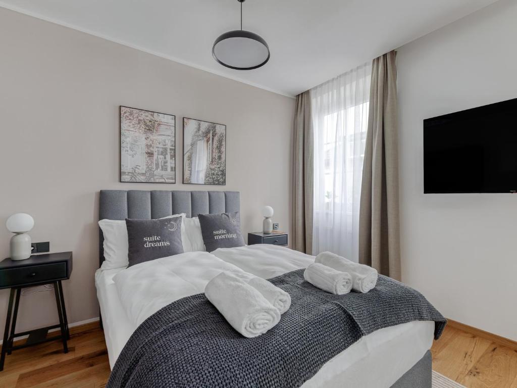 Posteľ alebo postele v izbe v ubytovaní limehome Villach Gerbergasse