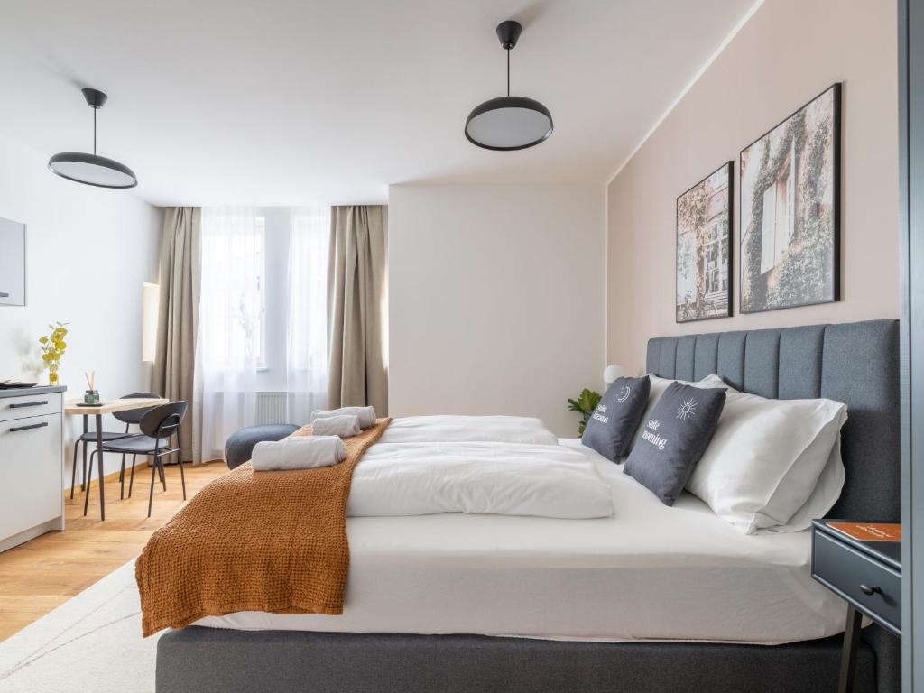 Posteľ alebo postele v izbe v ubytovaní limehome Villach Gerbergasse