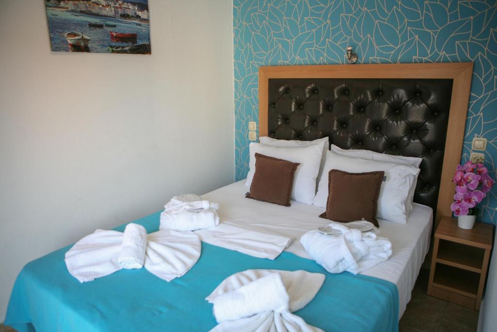 Postel nebo postele na pokoji v ubytování Hotel Karagianni