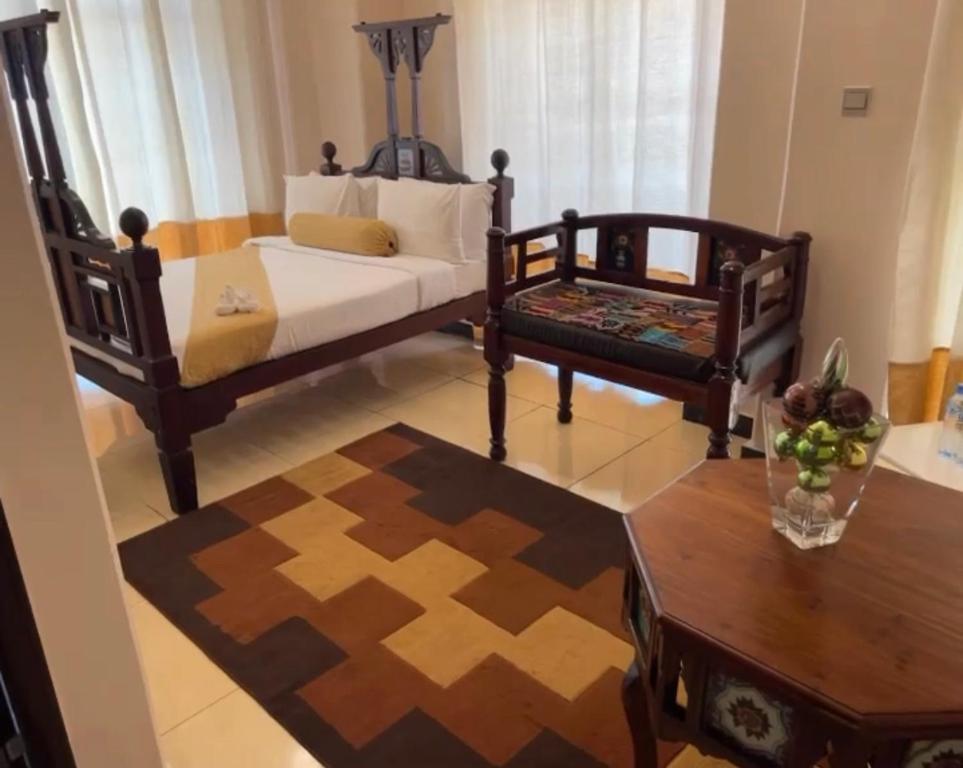 Postel nebo postele na pokoji v ubytování Dreams Hotel Zanzibar