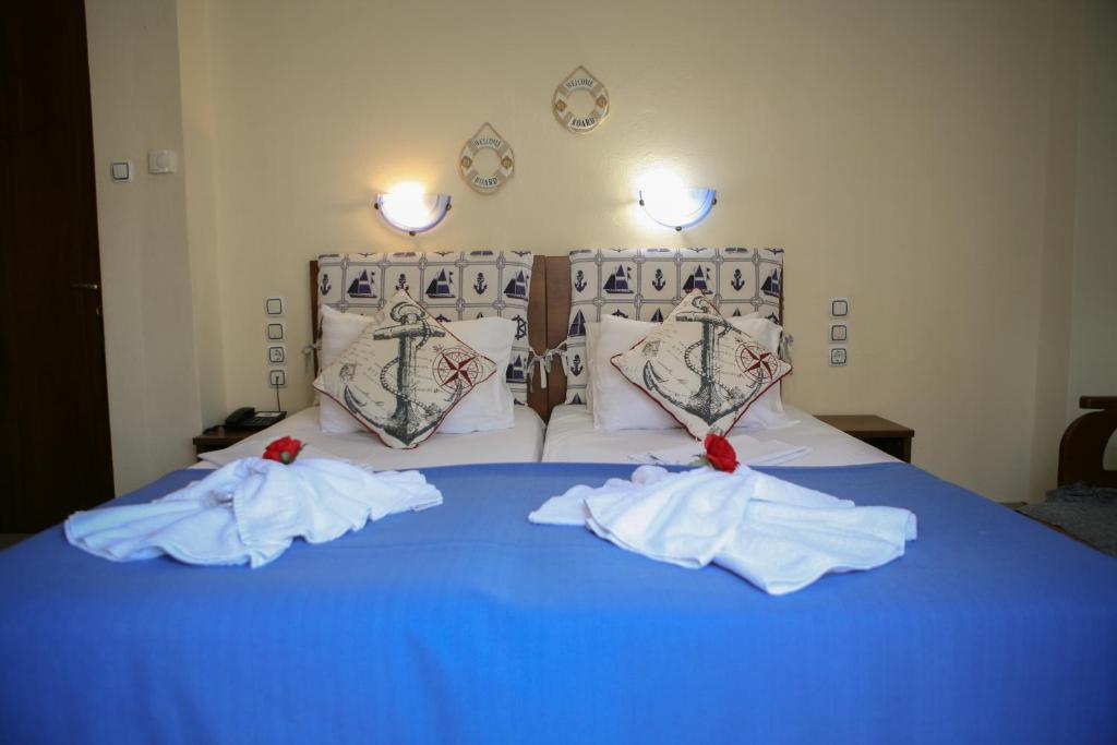 Postel nebo postele na pokoji v ubytování Hotel Karagianni
