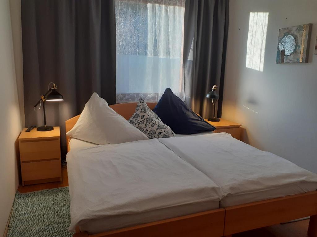 Postel nebo postele na pokoji v ubytování Apartmenthaus AMELIE