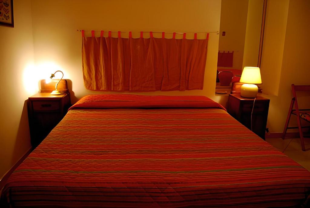 En eller flere senge i et værelse på Bed & Breakfast 5 Di Spade