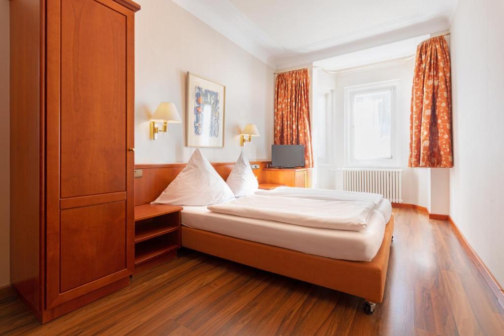 Postel nebo postele na pokoji v ubytování Hotel Müller