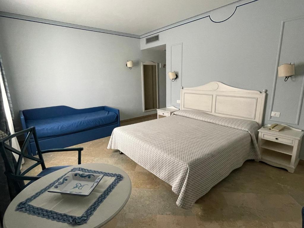 A bed or beds in a room at Relais Antiche Saline